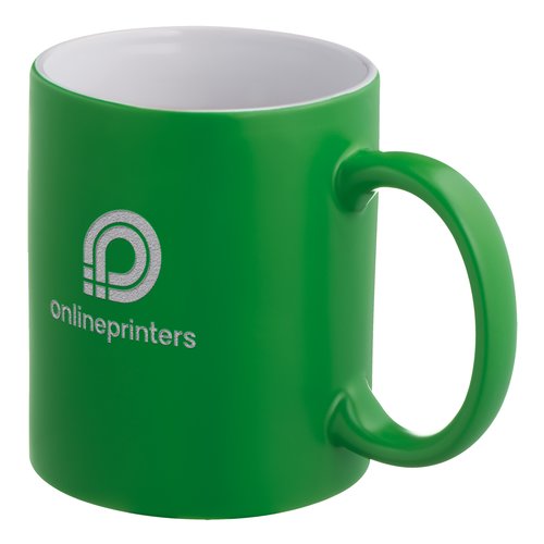 Tasse en cramique verte avec anse arrondie.