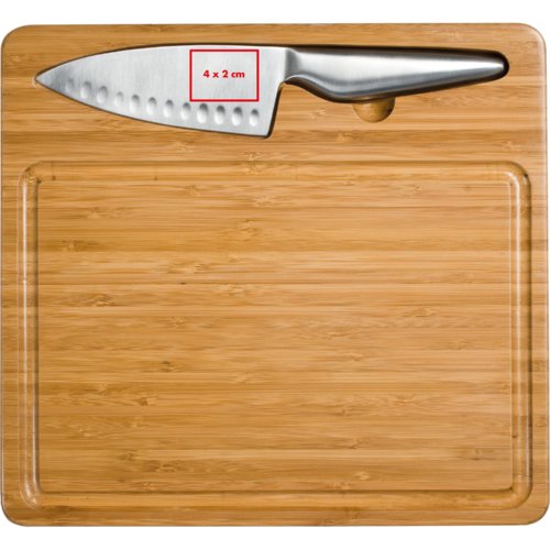 Planche  dcouper en bois avec couteau.