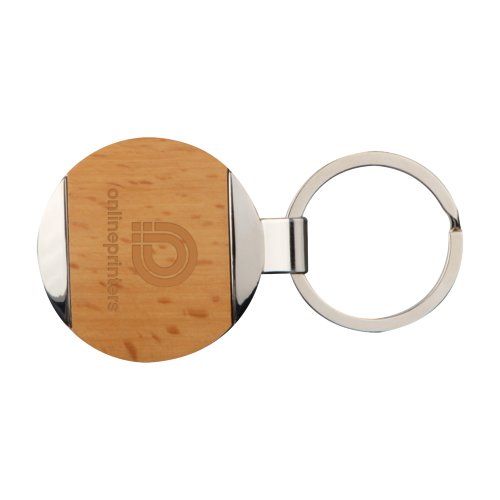 Porte-cls marron en mtal et bois avec motif et anneau mtallique.