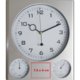 Horloge murale argente en plastique avec thermomtre et hygromtre.